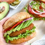 south west black bean burger with a burger and veggie ingredients in the background