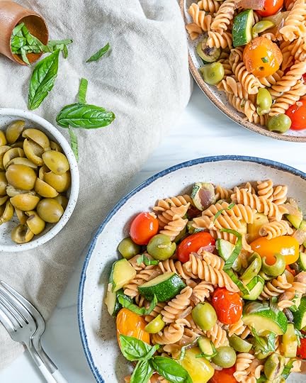 white plate of pasta with veggies