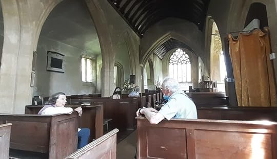 photo inside church of my dad and the churchwarden chatting