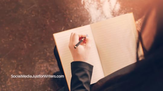 Book Marketing Update - Image of a woman writing in a notebook