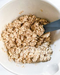 plum crisp ingredients in white bowl in white background