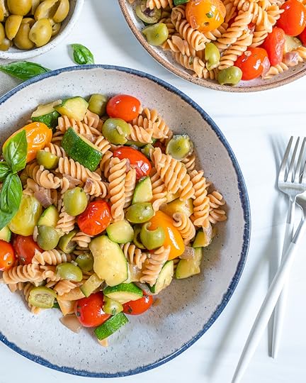 white plate of pasta with veggies