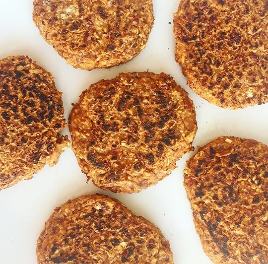 six burger patties in a white background