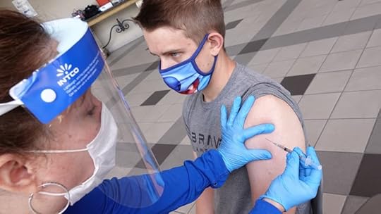 Student Jack Herrington receives a dose of a coronavirus disease (COVID-19) vaccine on the campus of the University of Memphis in Memphis, Tennessee, July 22, 2021.