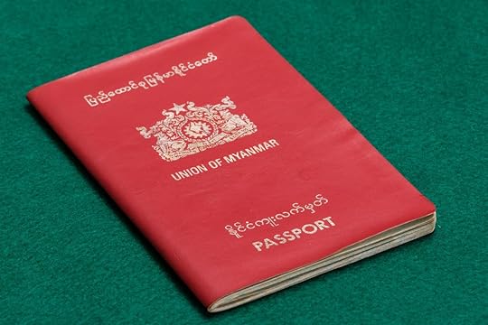 Myanmar Burmese passport on green table, weakest passports