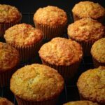 lemon poppy seed muffins cooling on a rack.