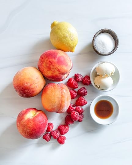 Roasted peaches Ingredients with a white marble background