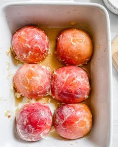 peaches in a white dish 