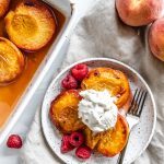 roasted peaches with raspberries topped ice cream