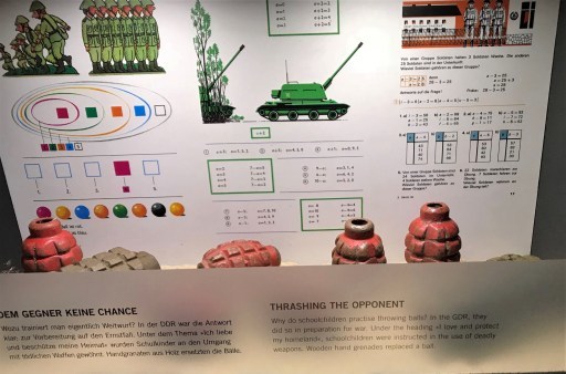 DDR Museum exhibit of what children learned in school, including how to throw wooden hand grenades