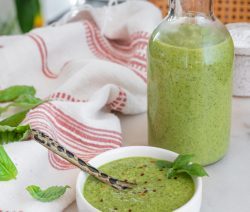 basil salad dressing ingredients in a white background