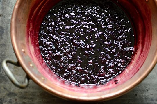 Cooked cherry blueberry jam in a copper preserving pan.