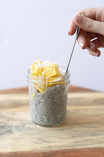 hand spoon tropical chia pudding blogilates
