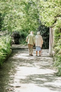 older couple walking hand in hand