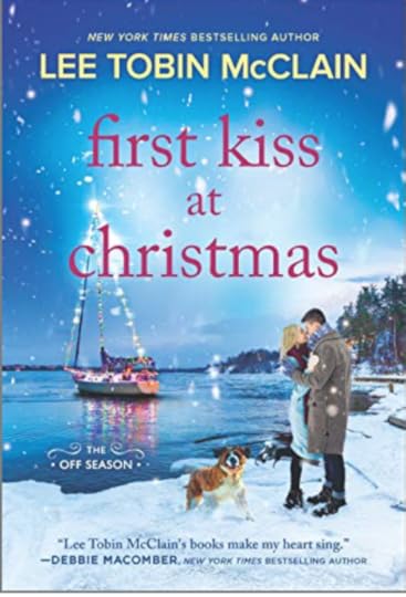 m/f couple embracing while st bernard dog romps beside them. Background has a sailboat with Christmas lights