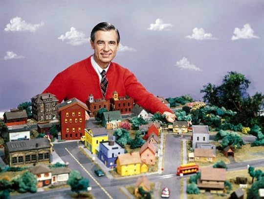 Mr. Rogers poses with his model town
