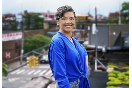 Sonia poses with blue shirt