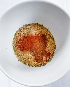 ingredients for Baked Zucchini Fries in a white bowl