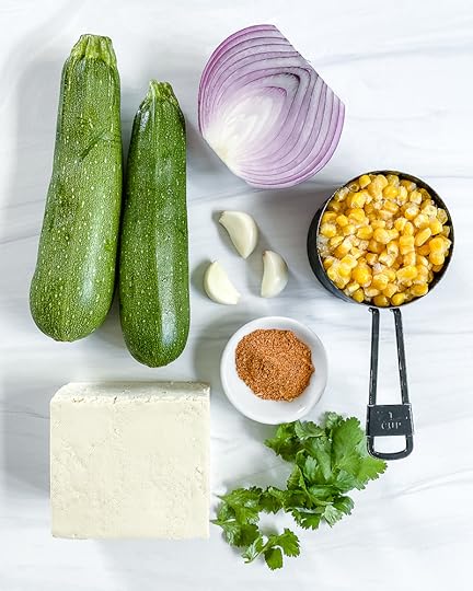 Tex-Mex Zucchini Boats Ingredients on white marble surface