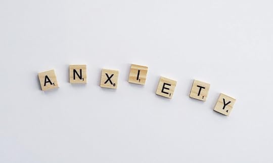 word anxiety spelled with wood letters