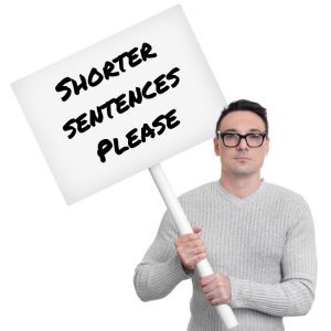 Man holding sign saying