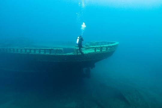 A diver inspects the bow of the wreck of the steel bulk freighter Grecian, where it rests in Lake Huron's Thunder Bay National Marine Sanctuary