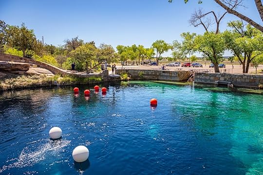 White and red bouys mark dive spots at the Blue Hole famous cenote in Santa Rosa, New Mexico
