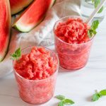 watermelon slushies in glass with a white background