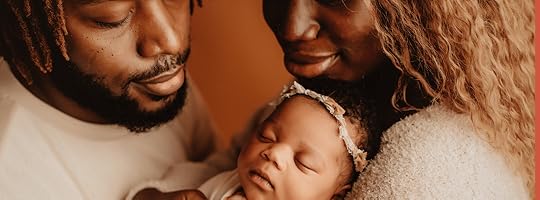 Family holding a baby
