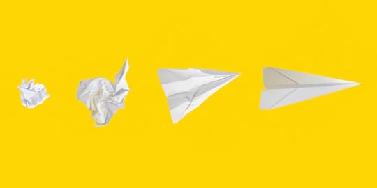 white paper airplanes, from crumpled to smooth, on yellow background
