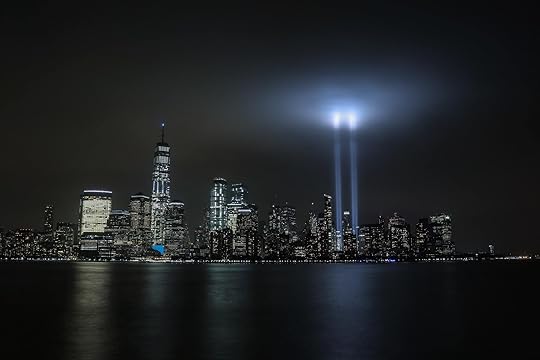 Photo of NY skyline at night with lights representing the lost WTC towers by Olga Subach from Unsplash