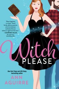 illustrated cover of a pretty white red-haired woman in a sexy black cocktail dress in the style of bewitched with sparkles going across the cover to indicate magic, a hot bearded white man in a plaid shirt and jeans stands behind her off to one side his back to her