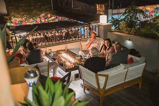 people eating and drinking at agave in los cabos