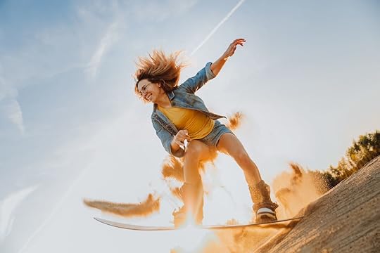 Tourist Sandboarding girl In the Desert jumps in and does a trick