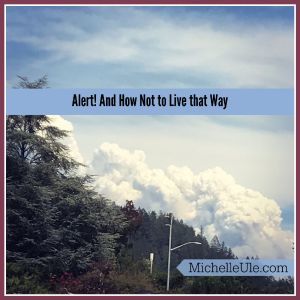 Alert warning of fire coming, white smoke rising