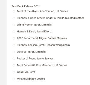 Text reads: Best Deck Release 2021, Tarot of the Abyss; Rainbow Kipper; White Numen Tarot; Heaven & Earth; 2020 Lenormand; Rainbow Seekers Tarot; Luna Sol Tarot; Pocket of Peers; Tarot Decoratif; Gold Lyre Tarot; Mystic Midnight Oracle