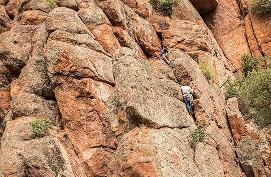 Two climbers scale a tall wall at Pinnacles National Park, Pacines, California, USA - October 11, 2018: Rock Climbing at Pinnacles National Park, California