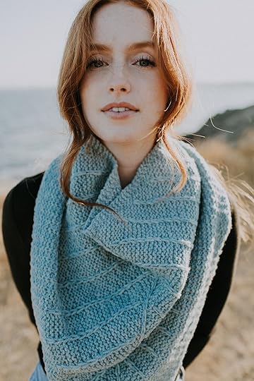 Close up of woman standing on bluff with red hair wearing turquoise textured knit cowl.jpg