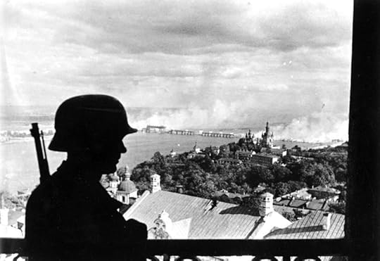 German sentinel in the citadel of Kiev with the burning Dnieper River Bridge in the background, 20 September 1941 (German Federal Archive: Bild 183-L20208)