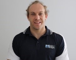 A portrait headshot of Travis Mattern of Fitness Education Online.