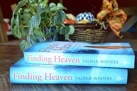 Spine view of book stack of Finding Heaven by Talena Winters. New cover edition now available in hardcover and paperback. “Would you go through hell to find heaven?”