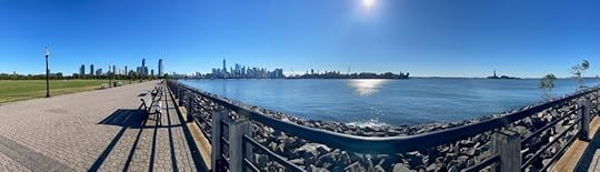 Panoramic photo from Liberty State Park showing the Manhattan skyline at left, Ellis Island at center, and the Statue of Liberty at right. It's simply gorgeous.
