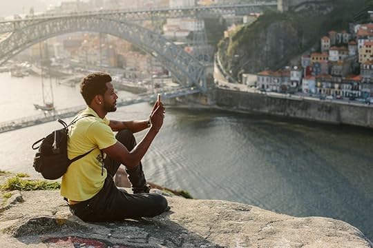 Traveler man doing photo on mobile phone. 