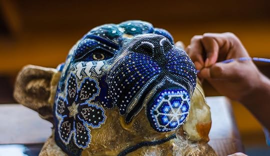 Mexican artisan making Huichol, a beautiful beaded artwork