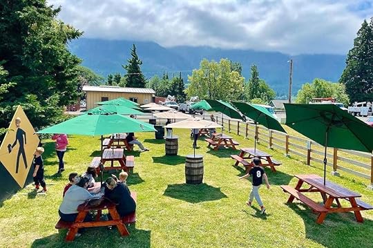 Tables outside on grass at Walking Man Brewing