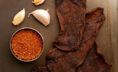 Smoked venison jerky with some of its main ingredients