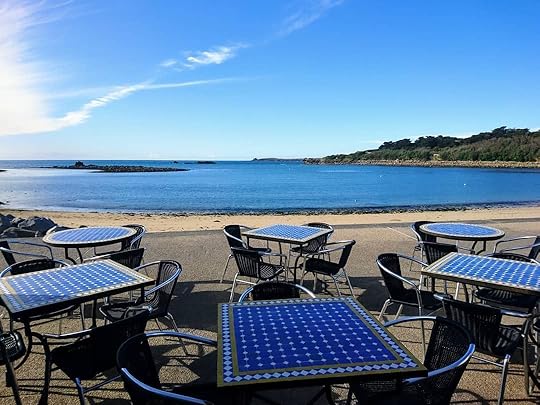 Outside tables by the sea at Dibble & Grub restaurant Isles of Scilly