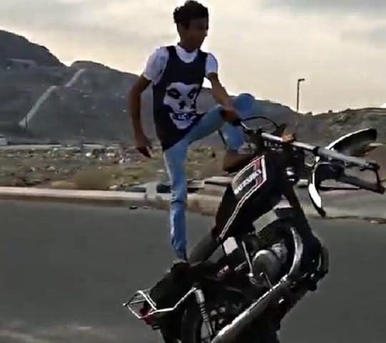 Teen male on a motorcycle