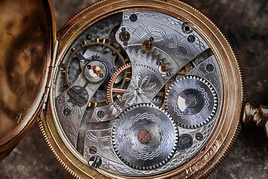A photo of the inner workings of a pocket watch, showing many tiny gears and screws. Modern imaging techniques let us see into the brain, so we can learn about Dyslexia and the Reading Brain.