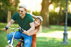 couple having fun riding bike together